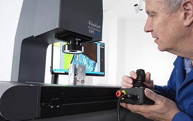 man using joystick to control LVC400 video measurement system