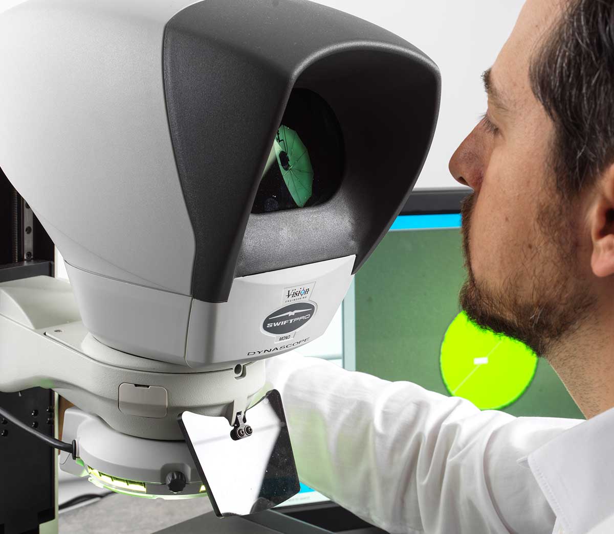 Man using Swift-PRO video measuring system inspecting packaging components