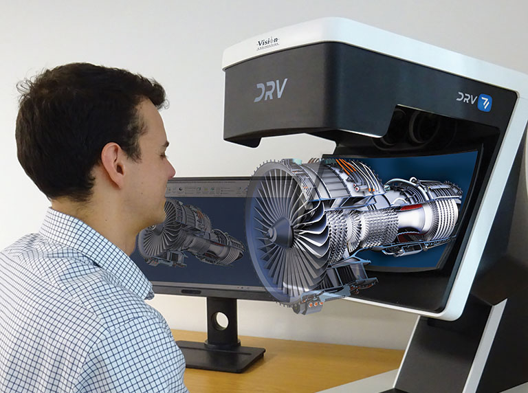 Man looking through DRV viewer inspecting engine in 3D