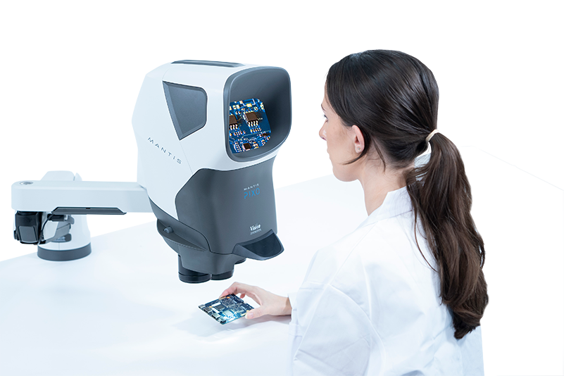 Woman soldering using a Mantis stereo microscope