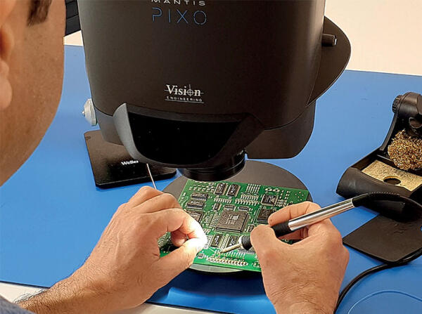hand soldering PCB under Mantis stereo microscope