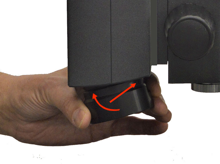 Hand showing quick change of lens on Makrolite 4K digital microscope